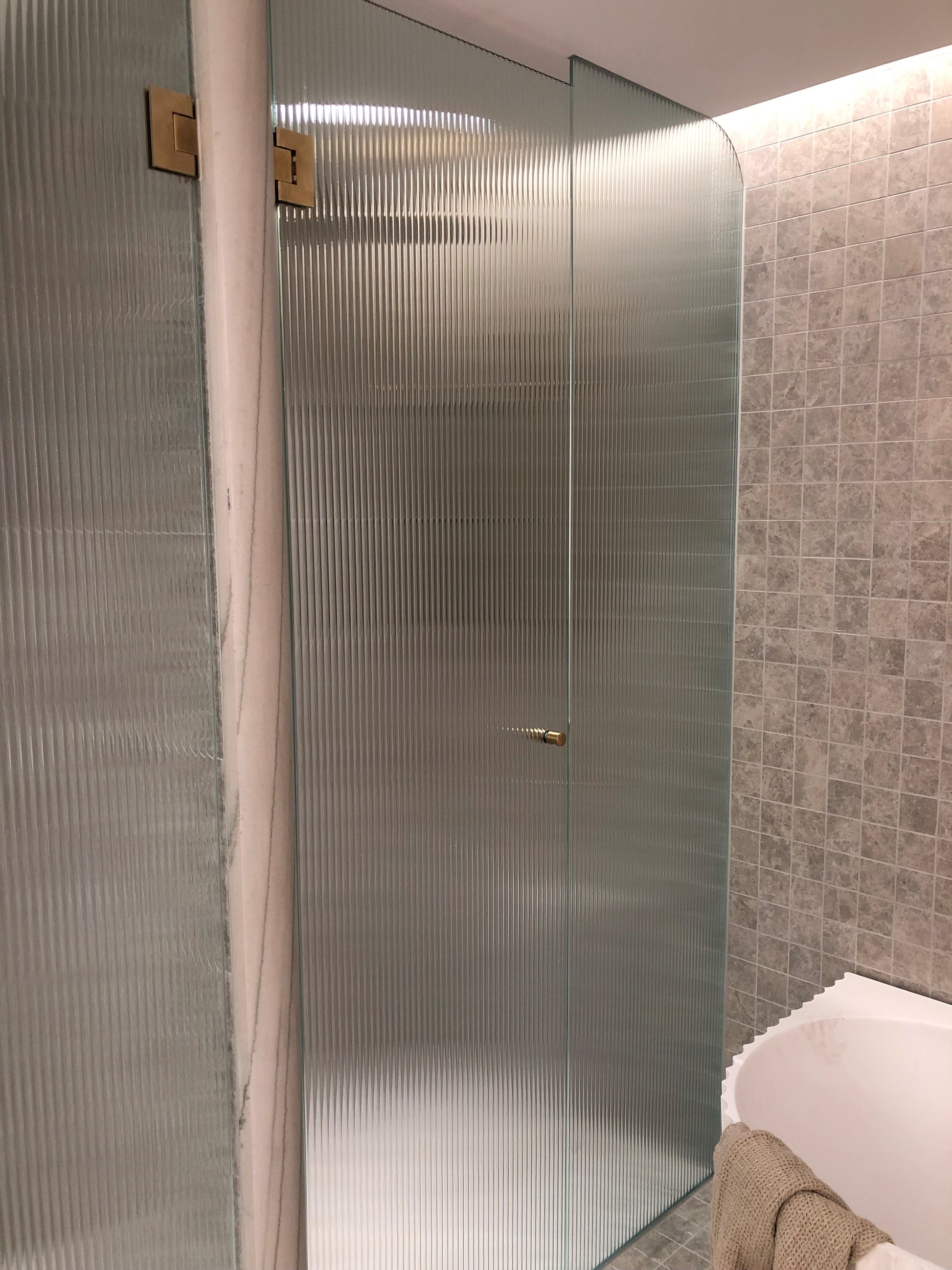 frameless shower panel made with fluted (Narrow Reeded)