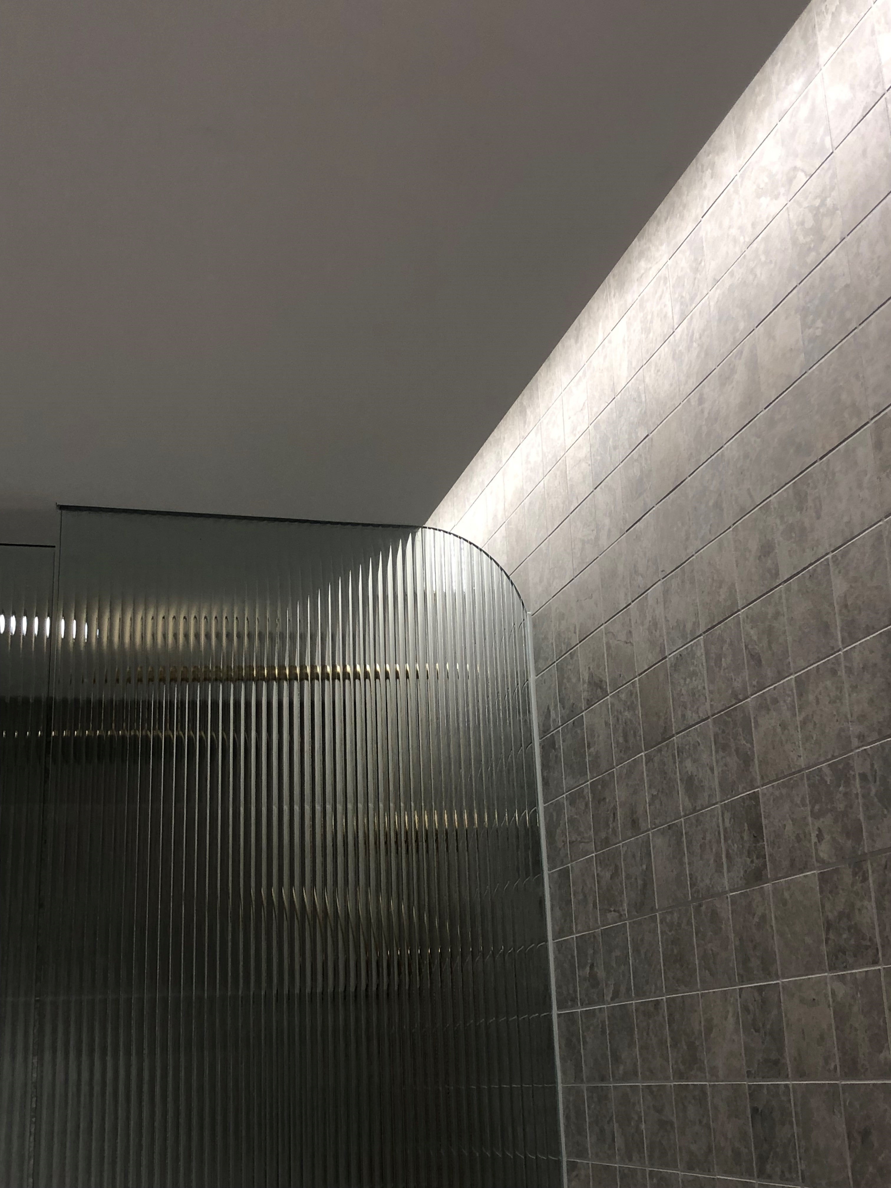 frameless shower panel made with fluted (Narrow Reeded)