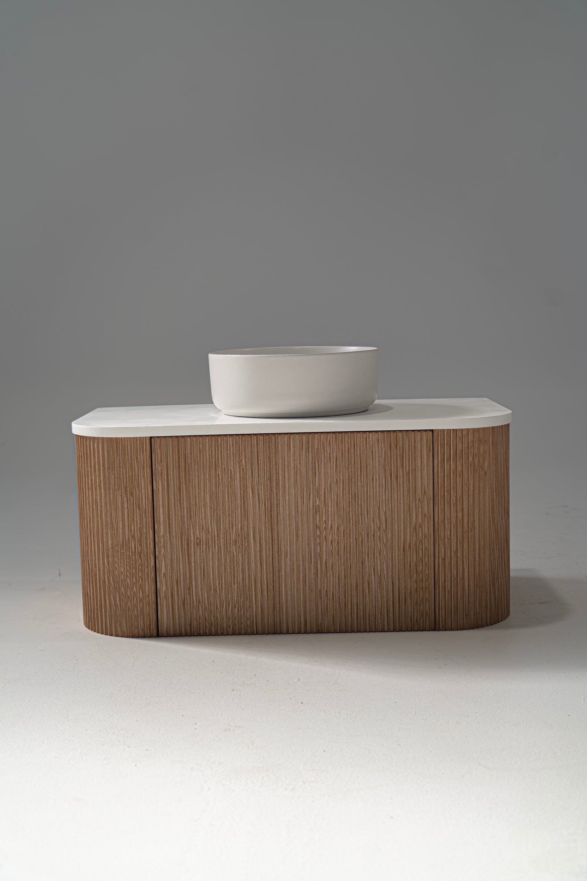 Portofino Oak Flute Vanity Unit with a white solid surface benchtop and a matte white ceramic basin